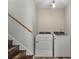 Convenient laundry area with a modern washer and dryer set, located near the stairway at 5052 Hidden Forest Ln, North Charleston, SC 29420
