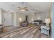 Bright living room showcasing wood floors, neutral tones, and ceiling fans at 5052 Hidden Forest Ln, North Charleston, SC 29420