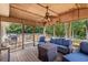 Covered porch with comfortable seating, a ceiling fan, and a grill at 5052 Hidden Forest Ln, North Charleston, SC 29420
