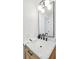 Charming bathroom features a marble countertop, modern fixtures, and a decorative mirror at 521 Carpenter St, Charleston, SC 29412