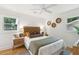Serene bedroom with a woven headboard, neutral tones, and natural light at 521 Carpenter St, Charleston, SC 29412