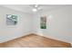 Bright, empty bedroom featuring hardwood floors, recessed lighting, and two windows at 521 Carpenter St, Charleston, SC 29412