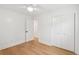 Minimal bedroom features hardwood floors, closet, ceiling fan, and white trim at 521 Carpenter St, Charleston, SC 29412