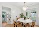 Dining area with modern chairs, a round table, and access to outdoor spaces at 521 Carpenter St, Charleston, SC 29412