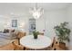 Elegant dining area with a round table, stylish chandelier, and comfortable seating at 521 Carpenter St, Charleston, SC 29412