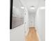 Bright hallway featuring hardwood floors and white walls with modern decor at 521 Carpenter St, Charleston, SC 29412