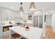 Bright kitchen with stainless steel appliances, a quartz island, and stylish pendant lighting at 521 Carpenter St, Charleston, SC 29412