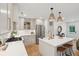 Open kitchen with stainless steel appliances, an island with seating, and bright lighting at 521 Carpenter St, Charleston, SC 29412