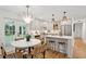Modern kitchen connecting to the dining area with stainless steel appliances and a breakfast bar at 521 Carpenter St, Charleston, SC 29412