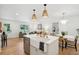 Modern kitchen with open layout, flowing into a dining area and living room at 521 Carpenter St, Charleston, SC 29412