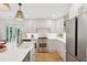 Bright kitchen showcasing stainless steel appliances, white cabinetry, and an inviting atmosphere for cooking and gathering at 521 Carpenter St, Charleston, SC 29412