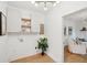 Laundry area with cabinetry and shelving, next to living area at 521 Carpenter St, Charleston, SC 29412