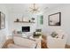 Bright living room featuring a fireplace, mantle and comfortable seating, perfect for relaxation at 521 Carpenter St, Charleston, SC 29412