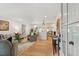 Open-concept living area with hardwood floors connecting to the kitchen and dining area, creating an inviting space at 521 Carpenter St, Charleston, SC 29412