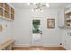 Clean mudroom with storage cubbies, bench, and a light fixture at 521 Carpenter St, Charleston, SC 29412