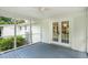 Enjoy this screened porch with a view of the backyard and detached two-car garage at 521 Carpenter St, Charleston, SC 29412