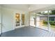 Enjoy this screened porch with a view of the backyard and detached two-car garage at 521 Carpenter St, Charleston, SC 29412
