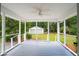 Enjoy this screened porch with a view of the backyard and detached two-car garage at 521 Carpenter St, Charleston, SC 29412