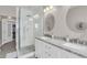 Bright bathroom with double vanity, marble countertop, and a glass-enclosed shower, creating a spa-like ambiance at 656 Coleman Blvd # 703, Mount Pleasant, SC 29464