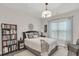 Comfortable bedroom featuring a well-dressed bed, neutral colors, and a decorative chandelier at 656 Coleman Blvd # 703, Mount Pleasant, SC 29464