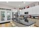 Modern kitchen with stainless steel appliances, large island, and abundant cabinet space for storage and meal preparation at 656 Coleman Blvd # 703, Mount Pleasant, SC 29464