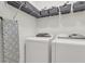 Well-lit laundry room with a washer, dryer, ironing board and shelving at 656 Coleman Blvd # 703, Mount Pleasant, SC 29464