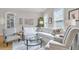 Bright living room with comfortable seating, a glass coffee table, and large windows at 656 Coleman Blvd # 703, Mount Pleasant, SC 29464