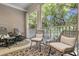 Relaxing screened porch featuring comfortable seating and a scenic outdoor view, perfect for enjoying nature at 656 Coleman Blvd # 703, Mount Pleasant, SC 29464