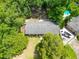 Aerial shot showcases the house and its surroundings, highlighting its peaceful, treed neighborhood location at 7 Azalea Ct, Goose Creek, SC 29445