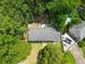 Aerial shot showcases the house and its surroundings, highlighting its peaceful, treed neighborhood location at 7 Azalea Ct, Goose Creek, SC 29445