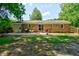 Large concrete patio in backyard with sliding doors, brick exterior, grill and yard furniture at 7 Azalea Ct, Goose Creek, SC 29445