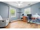 Bedroom with wood floors, a ceiling fan, a large window, and a desk setup at 7 Azalea Ct, Goose Creek, SC 29445