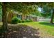 Beautiful brick home with a lush green lawn and a welcoming front porch and driveway at 7 Azalea Ct, Goose Creek, SC 29445