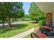 Inviting front porch with brick accents and cozy seating overlooking the neighborhood at 7 Azalea Ct, Goose Creek, SC 29445