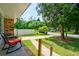 Cozy front porch seating area with brick detailing offering neighborhood views at 7 Azalea Ct, Goose Creek, SC 29445