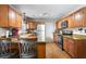 Spacious kitchen showcasing wooden cabinets, granite countertops, and stainless steel appliances at 7 Azalea Ct, Goose Creek, SC 29445