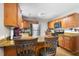 Bright kitchen featuring wood cabinets, stainless steel appliances, and a breakfast bar with stylish seating at 7 Azalea Ct, Goose Creek, SC 29445