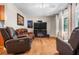 Open-concept living room with hardwood floors, fireplace, and plenty of seating at 7 Azalea Ct, Goose Creek, SC 29445