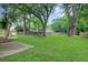 Expansive backyard with lush green grass, mature trees and fence at 709 Black Oak Blvd, Summerville, SC 29485