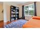 Bedroom featuring a bookcase, hardwood floors, and a large window at 709 Black Oak Blvd, Summerville, SC 29485