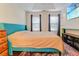 Well-lit bedroom featuring hardwood floors, a comfortable bed, and a mounted television at 709 Black Oak Blvd, Summerville, SC 29485