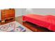 Bedroom featuring hardwood floors, a colorful rug, and a wooden dresser at 709 Black Oak Blvd, Summerville, SC 29485