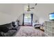 Spacious bedroom features a vaulted ceiling, a comfortable couch, and a large area rug at 709 Black Oak Blvd, Summerville, SC 29485
