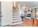 Bright foyer with staircase leading to the second floor, and hardwood floors leading to the living room at 709 Black Oak Blvd, Summerville, SC 29485