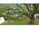 Traditional two-story home with an expansive green lawn, mature trees at 709 Black Oak Blvd, Summerville, SC 29485