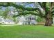 Traditional two-story home with an expansive green lawn, mature trees at 709 Black Oak Blvd, Summerville, SC 29485