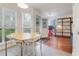 Eat-in kitchen with white cabinetry, stainless appliances, large bright windows, and adjoining breakfast area at 709 Black Oak Blvd, Summerville, SC 29485