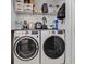 Laundry room features modern washer and dryer, utility sink, overhead storage, and bright lighting at 709 Black Oak Blvd, Summerville, SC 29485
