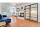 Cozy living room with hardwood floors, a fireplace, and plenty of natural light at 709 Black Oak Blvd, Summerville, SC 29485