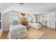 Bright secondary bedroom with twin beds, hardwood floors, and a stylish decor at 735 Woodward Rd, Charleston, SC 29407